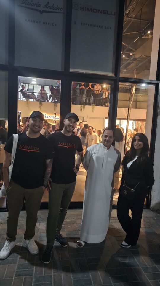 Antonio Orria stands with team members and guests outside the Simonelli Group Experience Lab in Dubai, celebrating his new role in the Middle East.