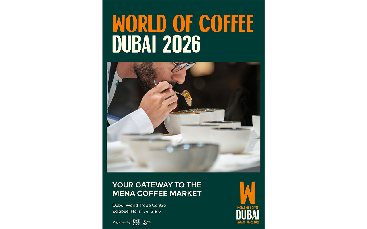 A coffee professional evaluates aroma and flavor at a cupping table, surrounded by steaming bowls during a coffee tasting session. The poster promotes “World of Coffee Dubai 2026” as the gateway to the MENA coffee market, with the event set to take place at the Dubai World Trade Centre from January 18–20, 2026