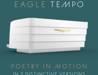 Rear view of the Victoria Arduino Eagle Tempo espresso machine in white, featuring a sleek layered design and gold emblem, displayed against a teal background with the slogan "Poetry in Motion – In 2 Distinctive Versions."