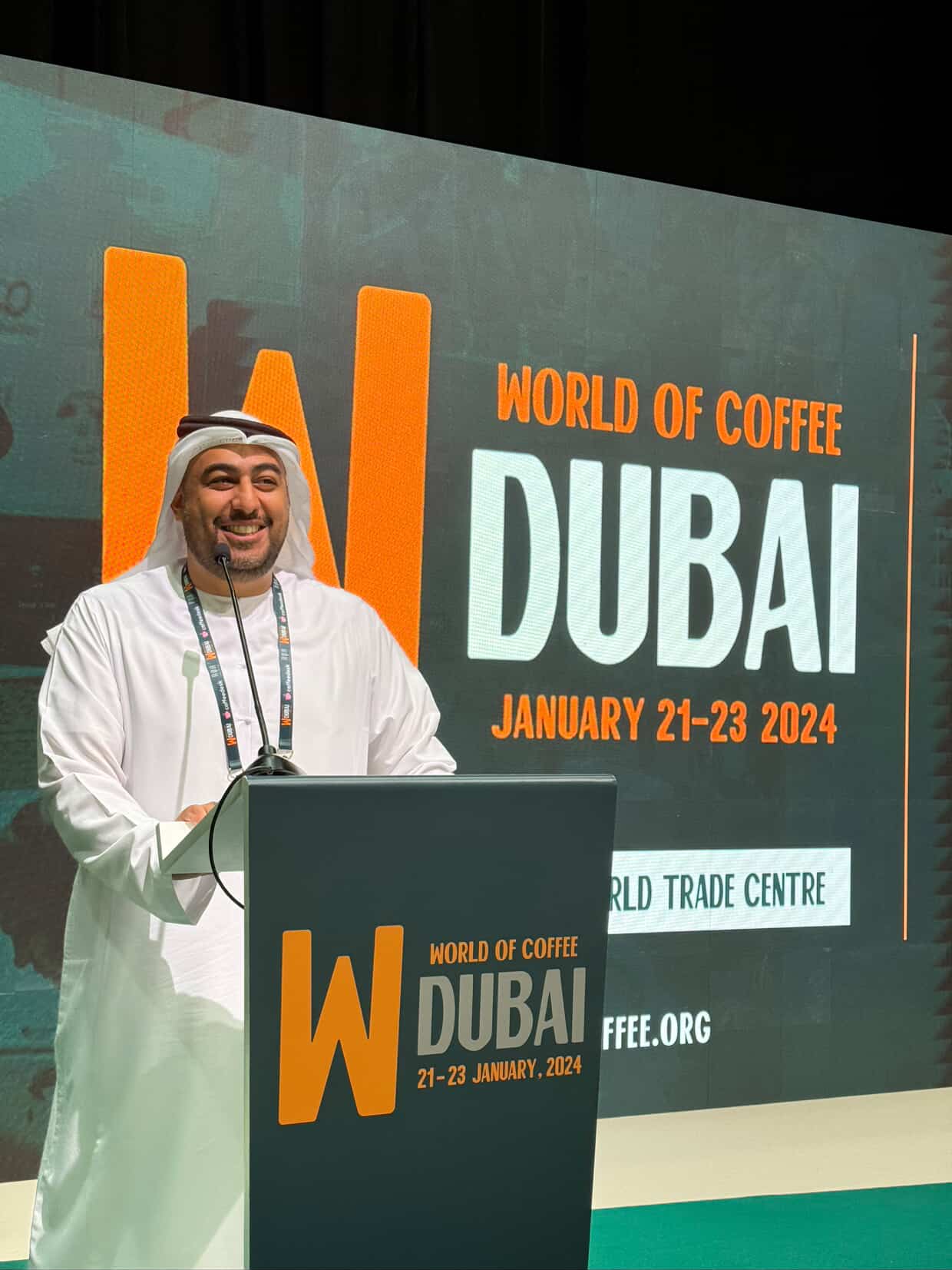 Saeed Rashid Al Baloushi speaking at the World of Coffee Dubai 2024 event at Dubai World Trade Centre.
