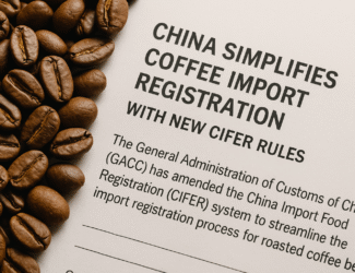 Alt text: Roasted coffee beans placed next to a printed document highlighting new Chinese CIFER rules simplifying coffee import registration.