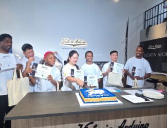 The winners and participants of the Drinkit Barista Championship 2025 in Dubai celebrating with certificates and a Drinkit cake at Victoria Arduino Experience Center.