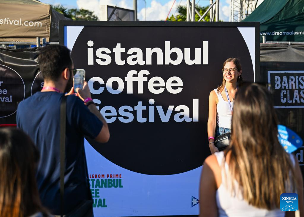 Visitors take photos at the Istanbul Coffee Festival in Türkiye, Sept. 13, 2025.