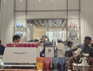 Baristas preparing pour-over coffee at Mokha 1450’s fourth boutique inside Modora’s luxury showroom in Dubai during the launch event.