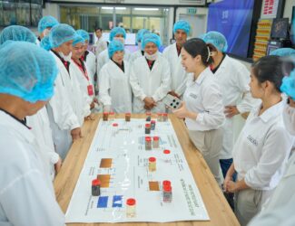 Outstanding farmers from the NESCAFÉ Plan program visited the Nestlé Trị An factory to learn about the production process and explore the different types of coffee beans prepared for export.